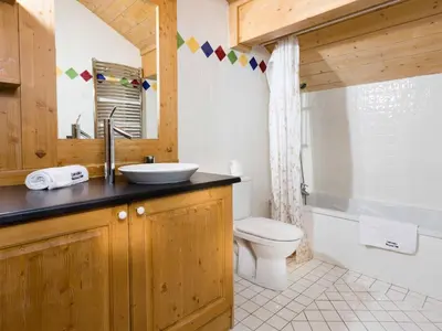 a bathroom with a sink and a toilet at Apartment Die Sonnailles apartment by Interhome in Chamonix-Mont-Blanc