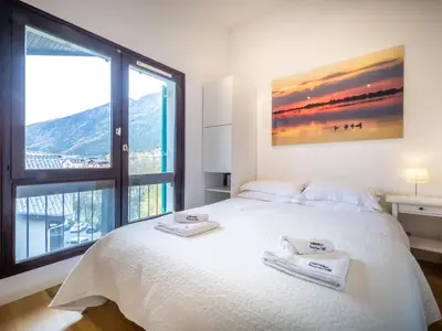 a bedroom with a white bed with two towels on it at Apartment Rupicapra Wohnung by Interhome in Chamonix-Mont-Blanc