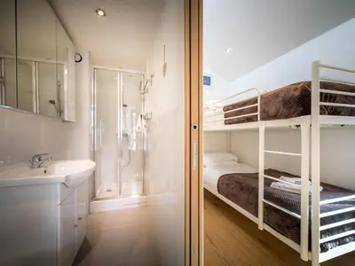 a bathroom with a bunk bed and a sink and a shower at Apartment Rupicapra Wohnung by Interhome in Chamonix-Mont-Blanc
