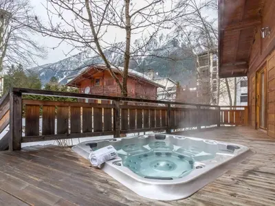 a jacuzzi tub on the deck of a house at Holiday Home Chalet des Souchettes by Interhome in Chamonix-Mont-Blanc