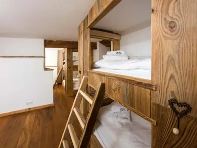 a room with a bunk bed and a ladder at Holiday Home Chalet des Souchettes by Interhome in Chamonix-Mont-Blanc