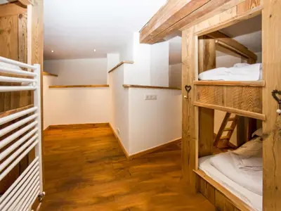 a room with bunk beds in a hostel at Holiday Home Chalet des Souchettes by Interhome in Chamonix-Mont-Blanc