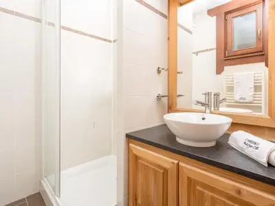 a bathroom with a sink and a shower at Apartment Angenehme Wohnung in Chamonix Centre-Ville by Interhome in Chamonix-Mont-Blanc