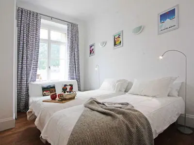 a bedroom with two beds and a window at Apartment Wohnung Alpines Museum by Interhome in Chamonix-Mont-Blanc