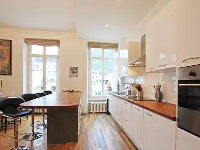 a kitchen with a table and chairs in it at Apartment Wohnung Alpines Museum by Interhome in Chamonix-Mont-Blanc
