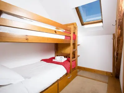 a bedroom with two bunk beds and a window at Apartment Die Belle Epoque Wohnung by Interhome in Chamonix-Mont-Blanc
