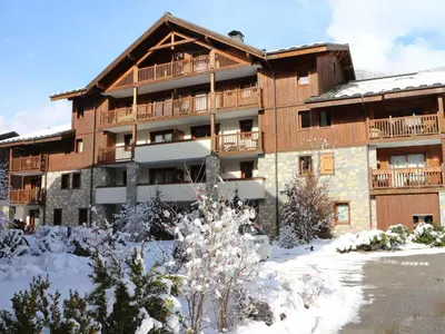 a large apartment building with snow in front of it at Appartement 6 pers, proche centre Samoëns, parking inclus - FR-1-815-115 in Samoëns
