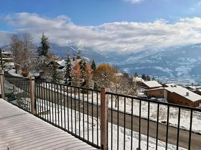 a balcony with a view of a snow covered mountain at Chalet vue panoramique in Passy