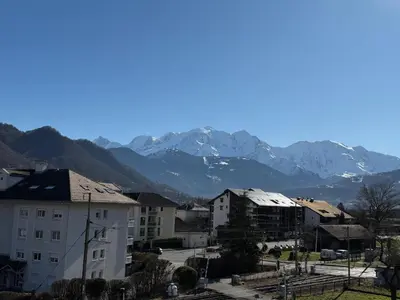 a view of a city with mountains in the background at Calm & Cozy Apartment with Parking in Sallanches in Sallanches