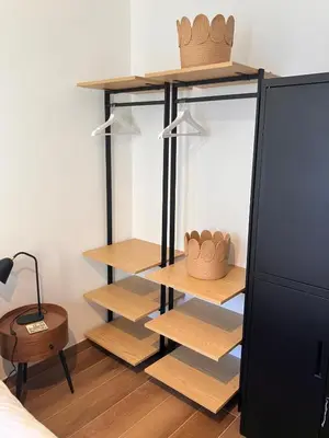 a closet with wooden shelves and baskets on it at Calm & Cozy Apartment with Parking in Sallanches in Sallanches