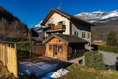 a house with a balcony on top of it at Tiny Chalet - near to Servoz train station in Les Houches