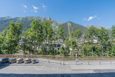 a snowy mountain view of a city with snow covered mountains at Chamonix Sud - Grepon 104 - Happy Rentals in Chamonix-Mont-Blanc