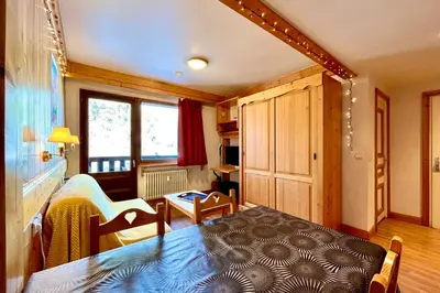 a living room with a table and a dining room at Escape Mountain Apartment with Stunning Views in Combloux