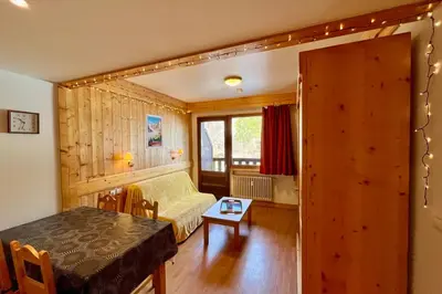 a living room with a couch and a table at Escape Mountain Apartment with Stunning Views in Combloux