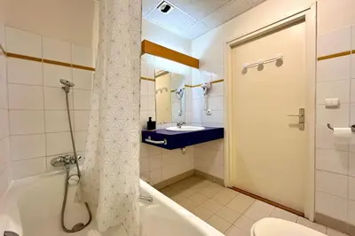 a bathroom with a shower and a toilet and a sink at Escape Mountain Apartment with Stunning Views in Combloux