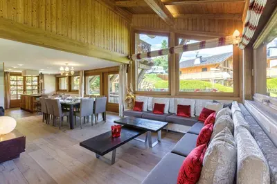 a living room with a couch and a table at Megepi Chalet 5CH Calme Remontee 400m Sauna Fitness in Demi-Quartier