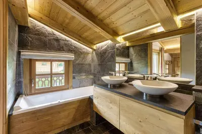 a bathroom with three sinks and a tub and a window at Megepi Chalet 5CH Calme Remontee 400m Sauna Fitness in Demi-Quartier