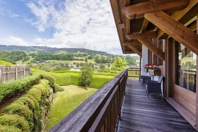a balcony of a house with a view of the countryside at Megepi Chalet 5CH Calme Remontee 400m Sauna Fitness in Demi-Quartier
