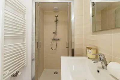 a bathroom with a sink and a shower at Terra Losa AlpinChic 2CH Central Remontee Vue Parking in Les Houches