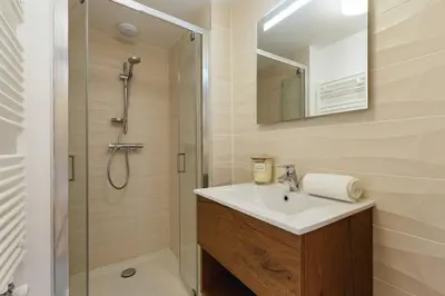 a bathroom with a sink and a shower at Terra Losa AlpinChic 2CH Central Remontee Vue Parking in Les Houches