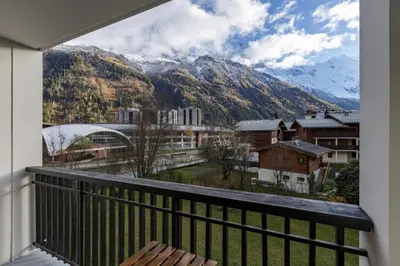 a balcony with a view of a mountain at Vallee Blanche Central 4pax Vue MtBlanc Parking 400m Remontee in Chamonix-Mont-Blanc