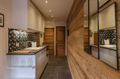a kitchen with two sinks and wooden walls at Vallee Blanche Central 4pax Vue MtBlanc Parking 400m Remontee in Chamonix-Mont-Blanc