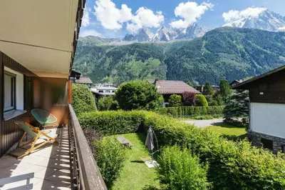 a balcony of a house with a view of mountains at Closy Modern 4pax Pied Piste Centre Balcon Parking in Chamonix-Mont-Blanc