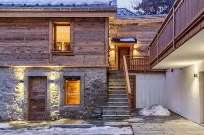 a wooden house with stairs leading up to it at Ocma1 Somptueux 6pax Central Parking Confort in Chamonix-Mont-Blanc