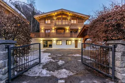 a house with a gate in front of it at Ocma3 Somptueux 6pax VueMtBlanc Central Parking in Chamonix-Mont-Blanc