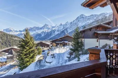 a view from a balcony of a ski resort in the mountains at Verny Appart 2CH Familiale Pied Pistes Piscine Vue in Les Houches