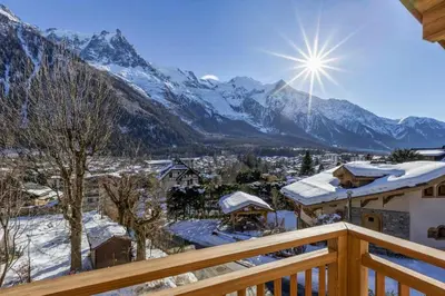 a view of a snowy mountain range from a balcony at Jacaranda2 Sublime 6pax Vue MtBlanc Central Parking in Chamonix-Mont-Blanc