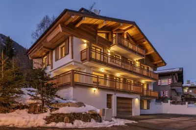 a large house with a balcony on top of it at Jacaranda4 Sublime 6pax 80m2 Vue MtBlanc Central Parking in Chamonix-Mont-Blanc