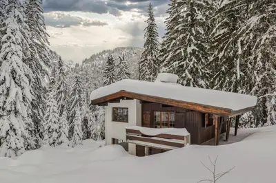 a cabin in the snow in a snowy forest at La Loriaz Chalet 7pax Nature Le Planet 5mn Argentiere in Chamonix-Mont-Blanc
