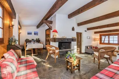 a living room with a couch and a fireplace at La Loriaz Chalet 7pax Nature Le Planet 5mn Argentiere in Chamonix-Mont-Blanc