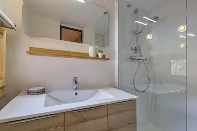 a bathroom with a sink and a shower at Roca Cosy Duplex Grands Montets Parking Transports in Chamonix-Mont-Blanc