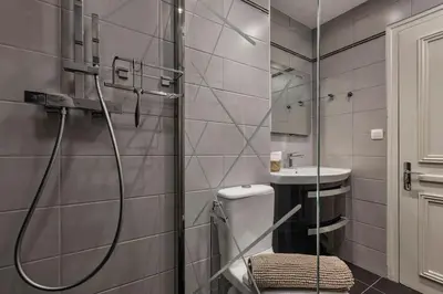 a bathroom with a shower and a toilet and a sink at Bios Moderne 3CH Vue Mt Blanc Aiguilles 3mn Brevent in Chamonix-Mont-Blanc
