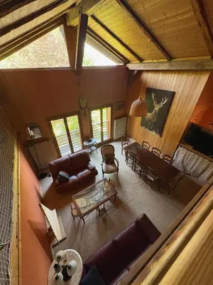 an overhead view of a living room with couches and chairs at La CHACUNIERE GRAND CHALET ST NICOLAS DE VEROCE, PRES DES PISTES in La Chapelle