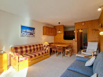 a living room with a couch and a table at Studio spacieux au pied des pistes avec terrasse et WIFI - FR-1-425-239 in Arâches-la-Frasse