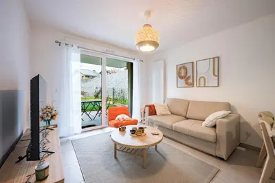 a living room with a couch and a table at Capucines des Alpes - Au pied du Mont Blanc in Saint-Gervais-les-Bains