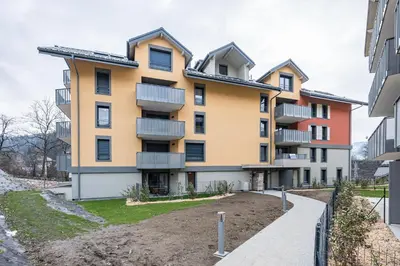 a building with balconies on the side of it at Capucines des Alpes - Au pied du Mont Blanc in Saint-Gervais-les-Bains