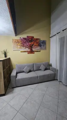 a living room with a couch in a room at Ecrin du Mont-Blanc - Duplex Panoramique in Sallanches