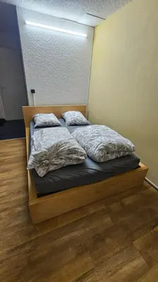 a bed with two pillows on it in a room at Ecrin du Mont-Blanc - Duplex Panoramique in Sallanches