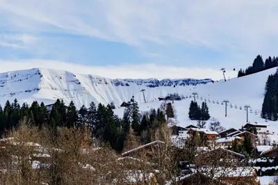 a snow covered mountain with a ski lift at Alpine Mood - Proche des pistes et Centre ville in Megève