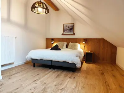 a bedroom with a large bed in a attic at La Source in Saint-Gervais-les-Bains