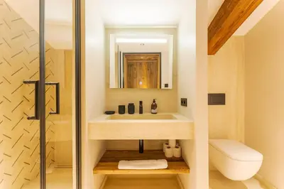 a bathroom with a sink and a toilet at Observatoire Sompteux Loft 3CHBR Elegant Vues in Megève