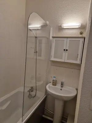 a bathroom with a shower and a sink at Pied des pistes, piscine, jacuzzi in Flaine