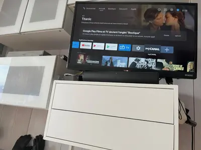 a flat screen tv sitting on top of a dresser at Terrasse du MtBlanc in Combloux