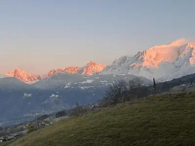a view of a mountain range with snow covered mountains at Terrasse du MtBlanc in Combloux