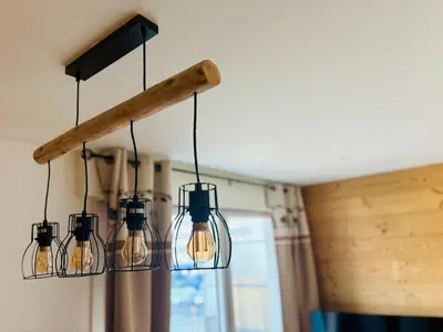 a group of glass lights hanging from a ceiling at L'écrin des quatre horizons in Saint-Gervais-les-Bains
