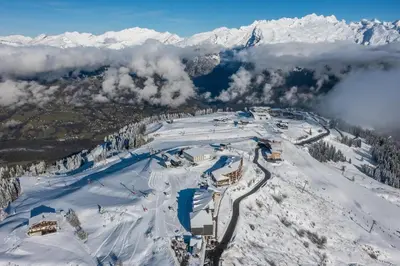 an aerial view of a ski resort in the snow at Appartement au pied des pistes - Vue imprenable in Samoëns